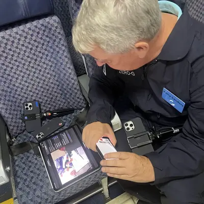 Kerry in zero gravity documenting NASA researchers